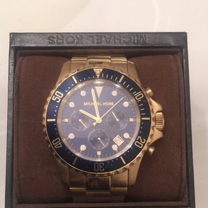 Gold Michael Kors watch with blue face